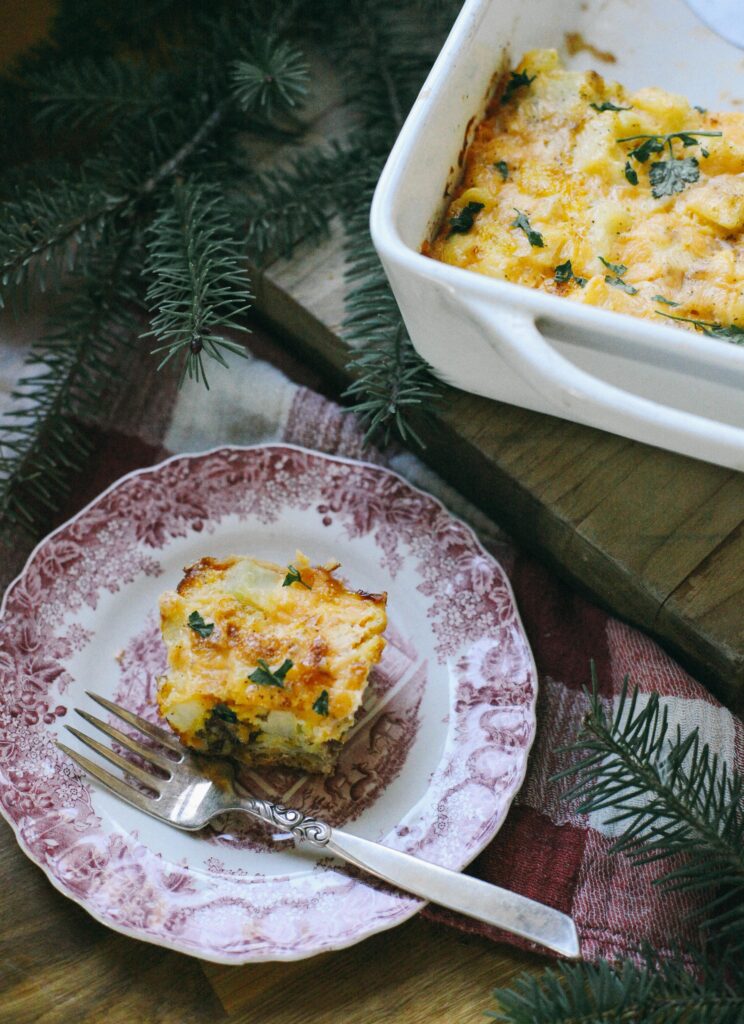 Photo of a piece of breakfast casserole on Christmas china