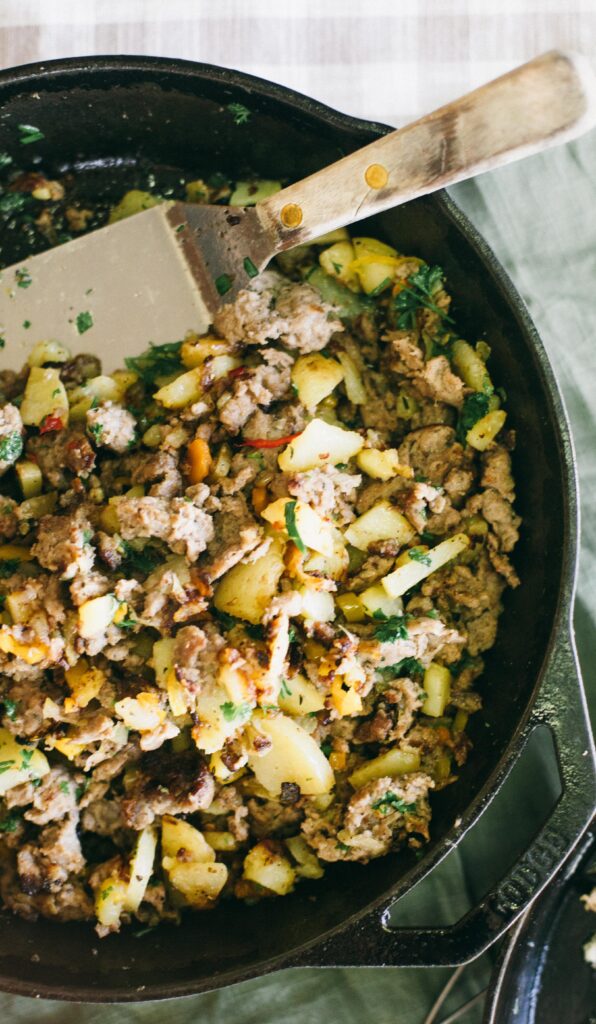 Image of a cast iron pan full of a Breakfast Skillet