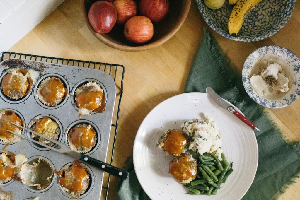 Image of Meatloaf Muffins with Mashed Potatoes and garden green beans in a farm kitchen