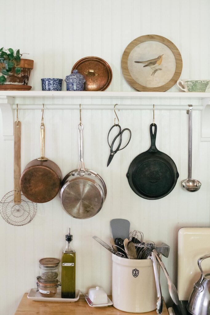 Image of a pot rack with beadboard in a farm cottage unfitted kitchen