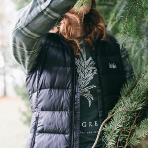 Image of a woman wearing a Potager Online Evergreen Gardening Tee