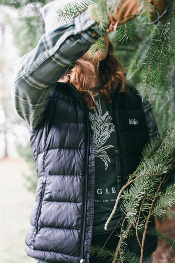 Image of a woman wearing a Potager Online Evergreen Gardening Tee