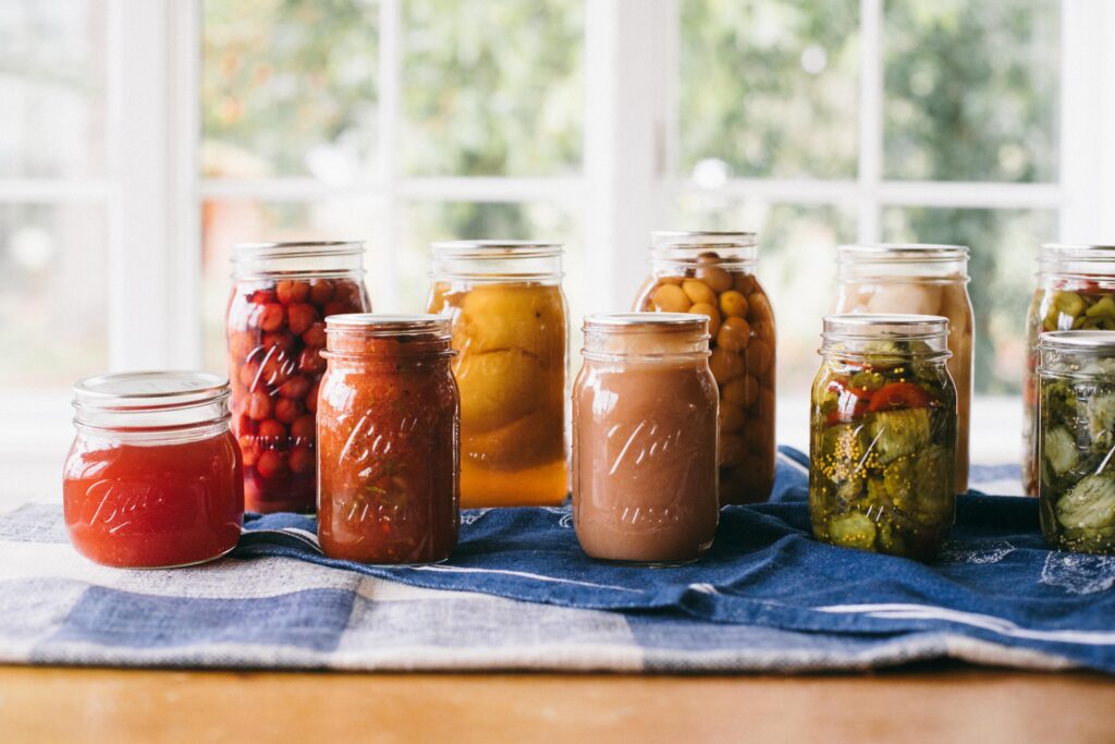 Image of garden preserves lined up on a farm table